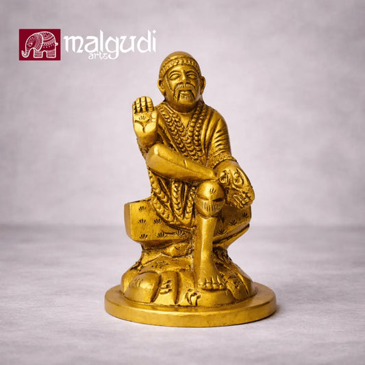 Brass statue of Sai Baba in blessing pose