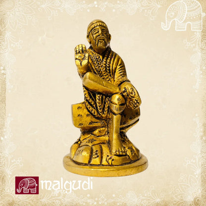 Brass statue of Sai Baba in blessing pose