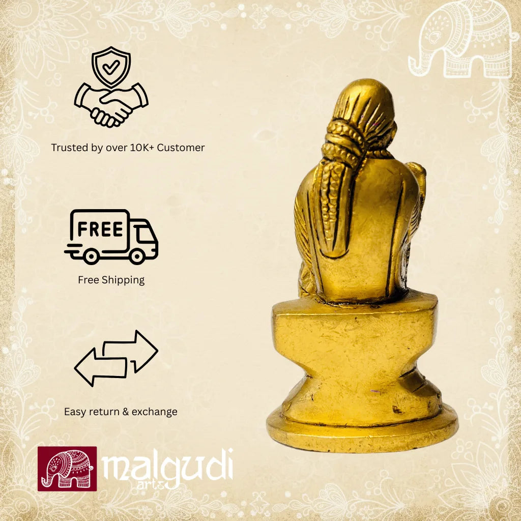 Brass statue of Sai Baba in blessing pose