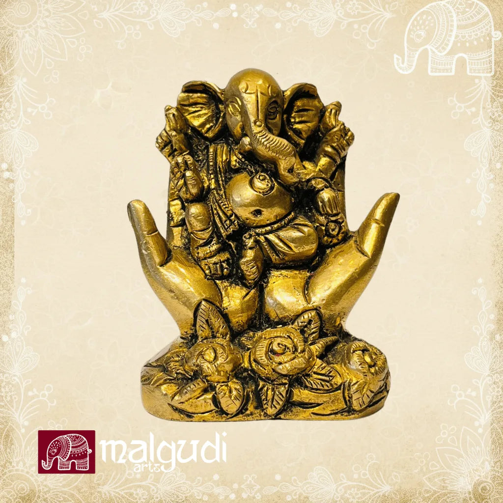 Golden Ganesha between open hands, 100% Brass
