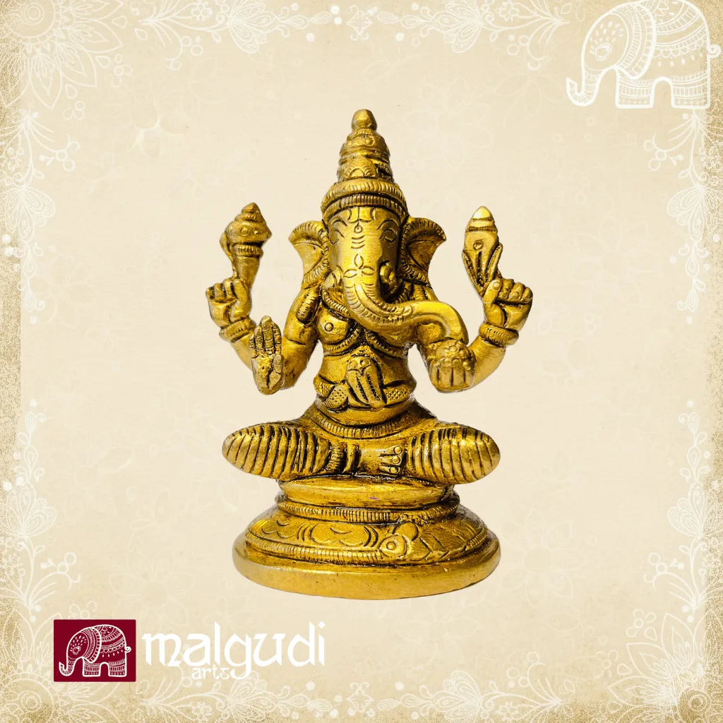 Brass Ganesha statue in lotus pose