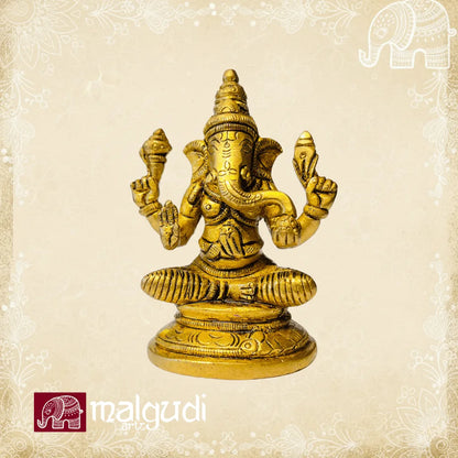 Brass Ganesha statue in lotus pose