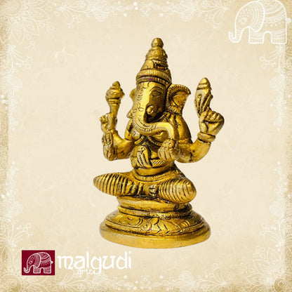 Brass Ganesha statue in lotus pose