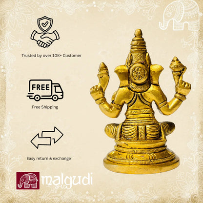 Brass Ganesha statue in lotus pose