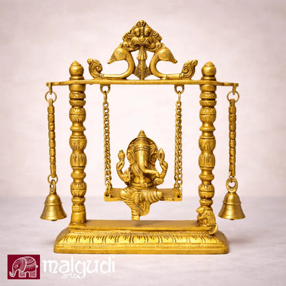 Ornate brass Ganesh on swing, with chain and bells
