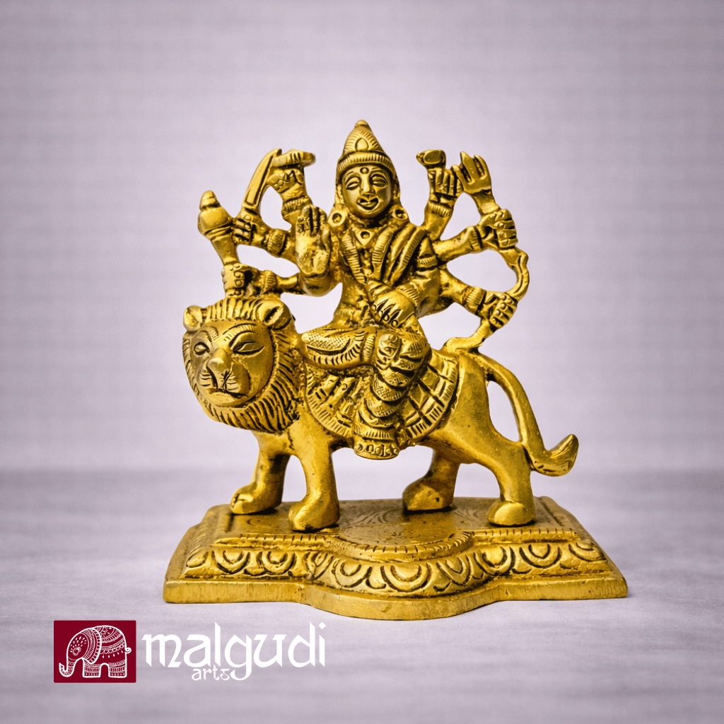 Brass Durga atop lion statue
