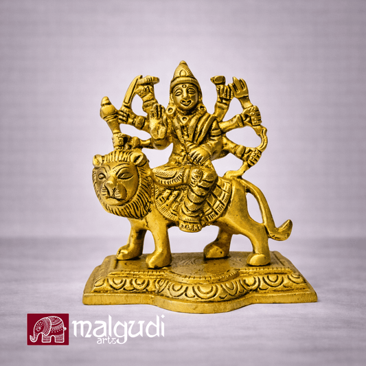 Brass Durga atop lion statue