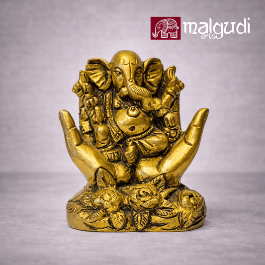 Golden Ganesha between open hands, 100% Brass